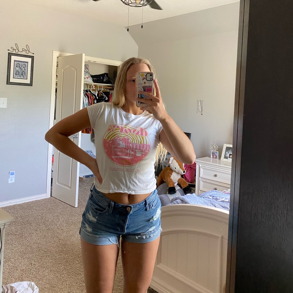 white band tee with pink graphic